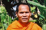 a photograph of a monk and his dog.